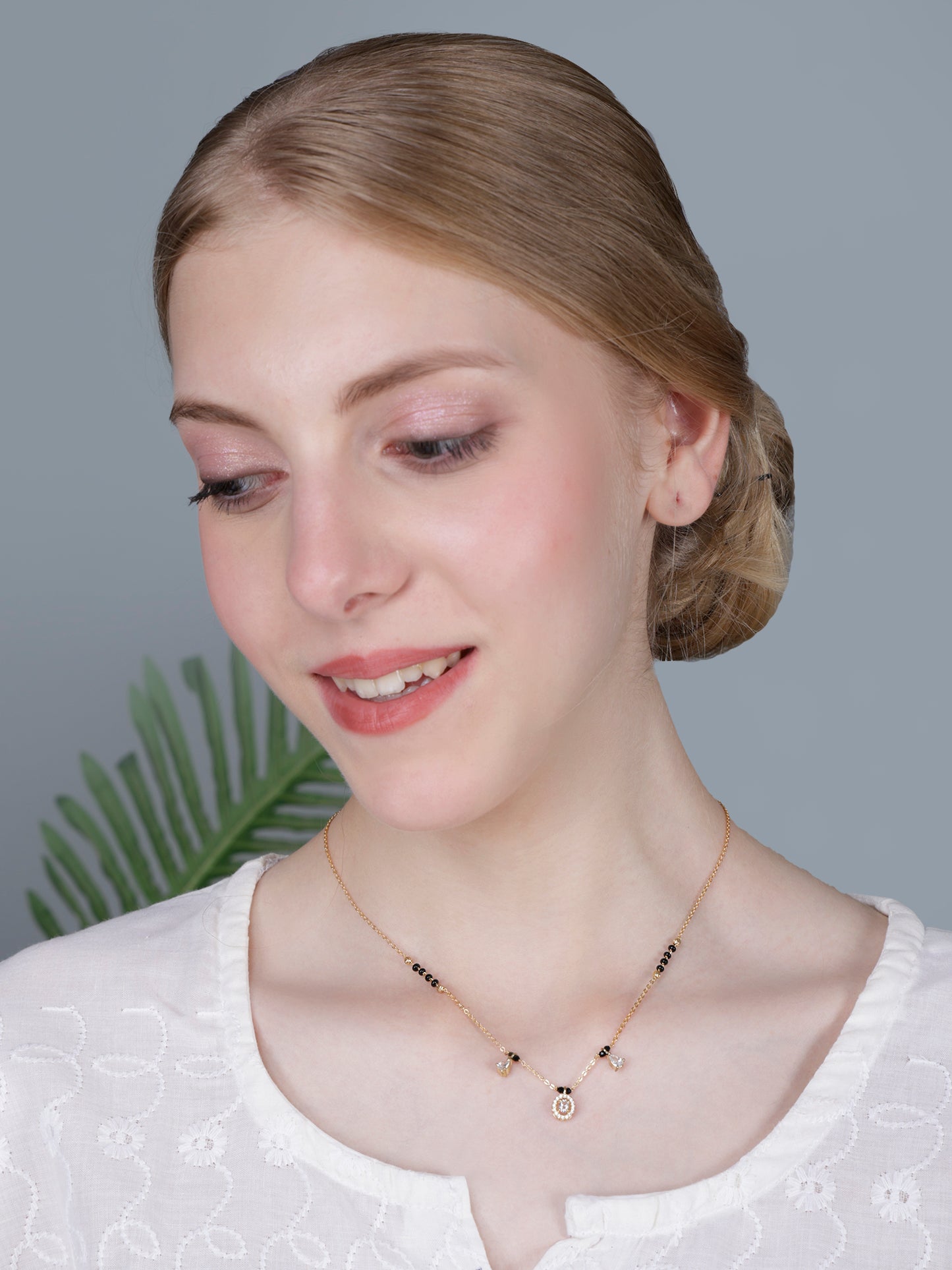 Elegant Black Bead Gold-Plated Mangalsutra Necklace with Oval Crystal Pendant