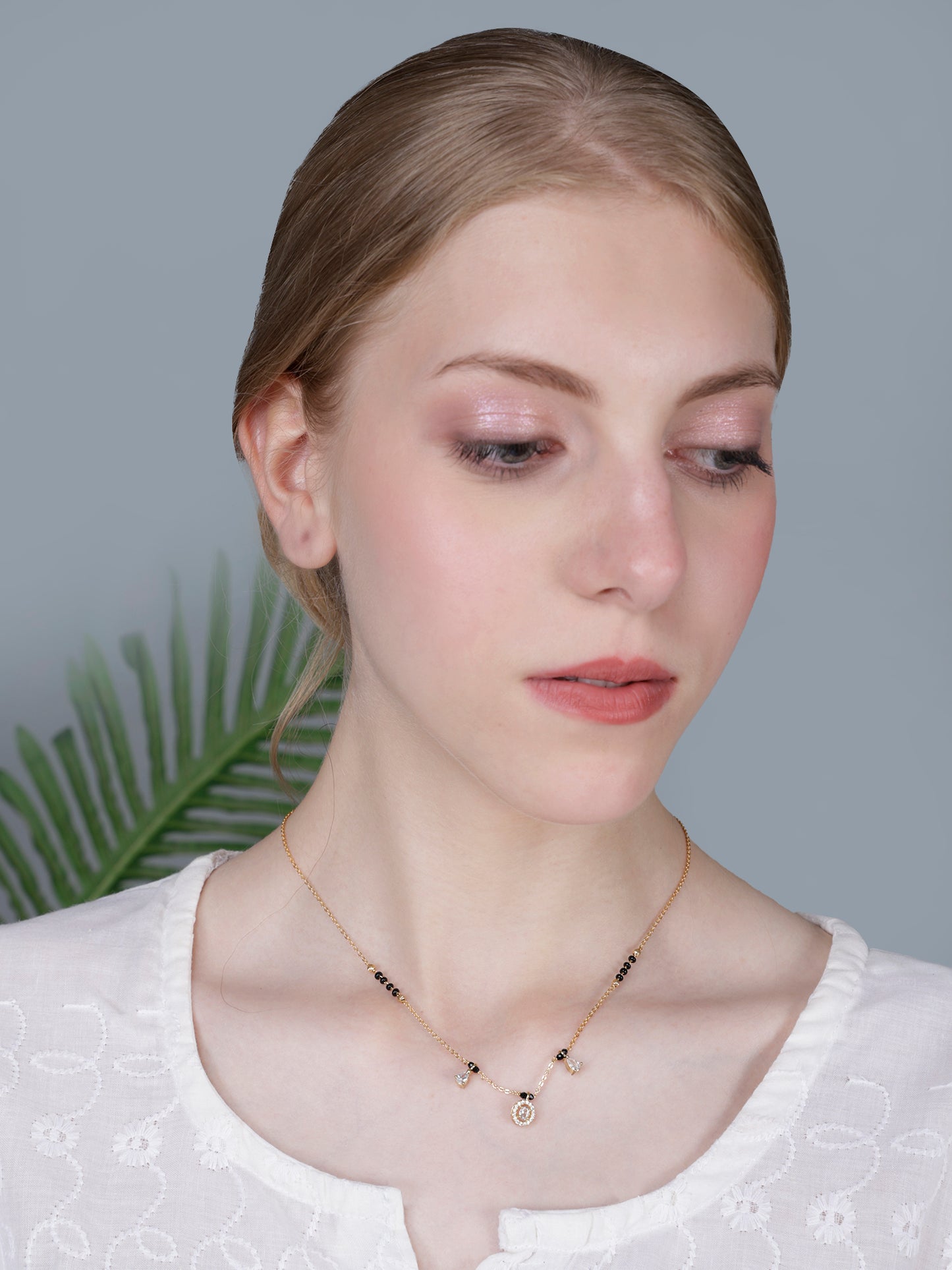 Elegant Black Bead Gold-Plated Mangalsutra Necklace with Oval Crystal Pendant