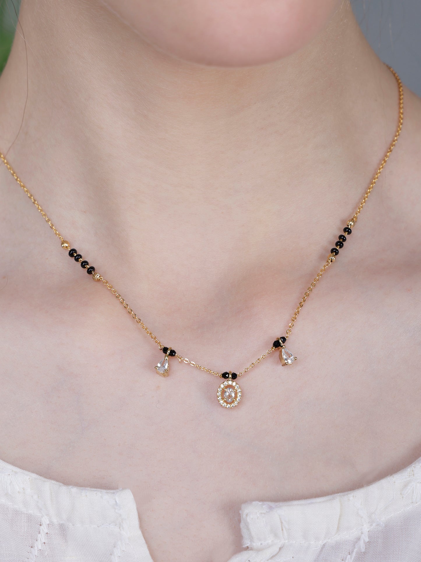 Elegant Black Bead Gold-Plated Mangalsutra Necklace with Oval Crystal Pendant