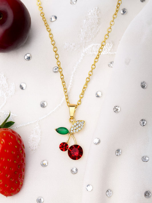 Full view of the latest gold necklace designs with a vibrant red and green cherry pendant hanging from an elegant gold-plated chain