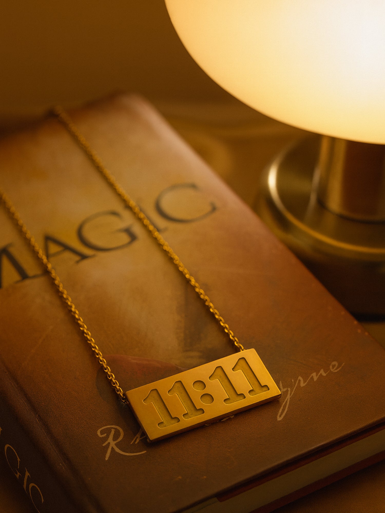 Latest gold necklace designs: An 11:11 angel number engraved gold bar pendant on a delicate chain