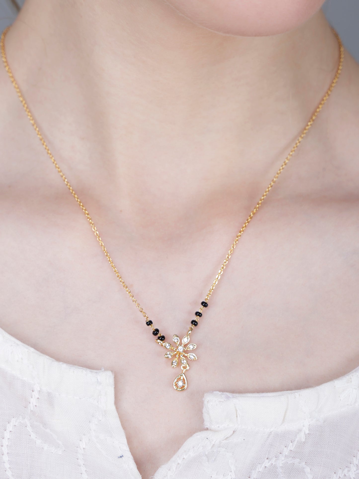 Delicate Black Bead Gold-Plated Mangalsutra with Floral Crystal Pendant