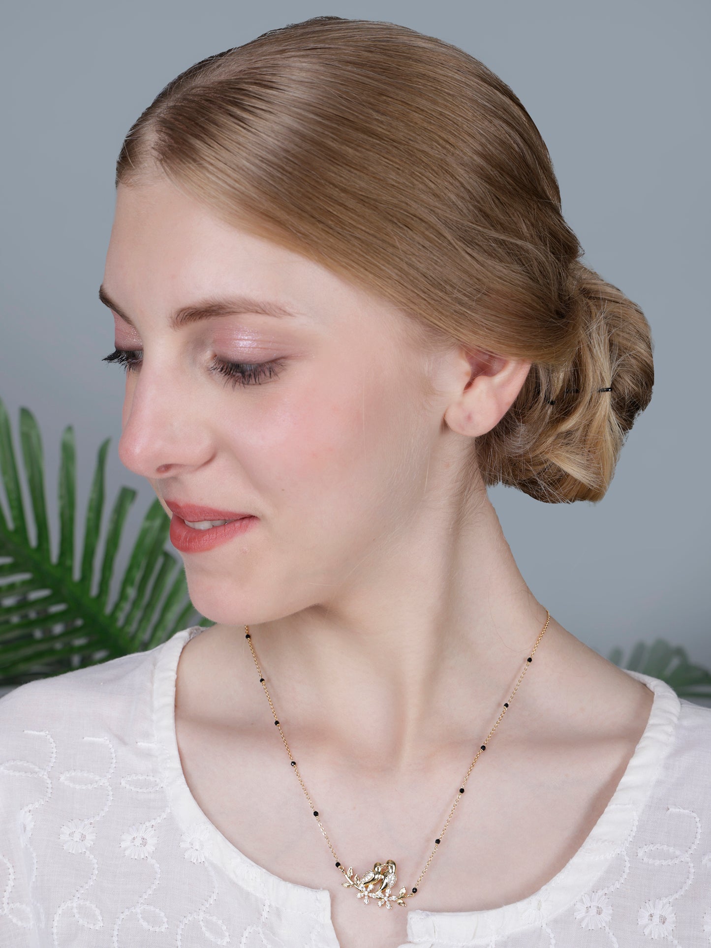 Romantic Lovebirds Gold-Plated Black Bead Mangalsutra with Crystal Accents