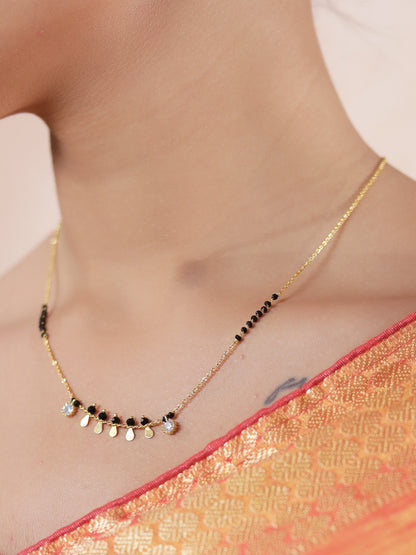 Trending mangalsutra design with gold chain, black beads and drop charms