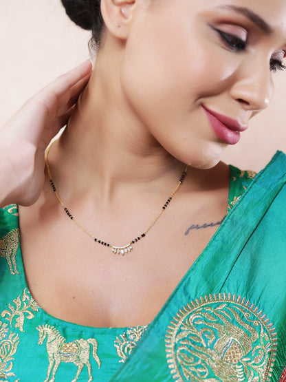 Short, delicate black beads mangalsutra gold design featuring a contemporary crescent pendant with hanging marquise-cut American diamonds