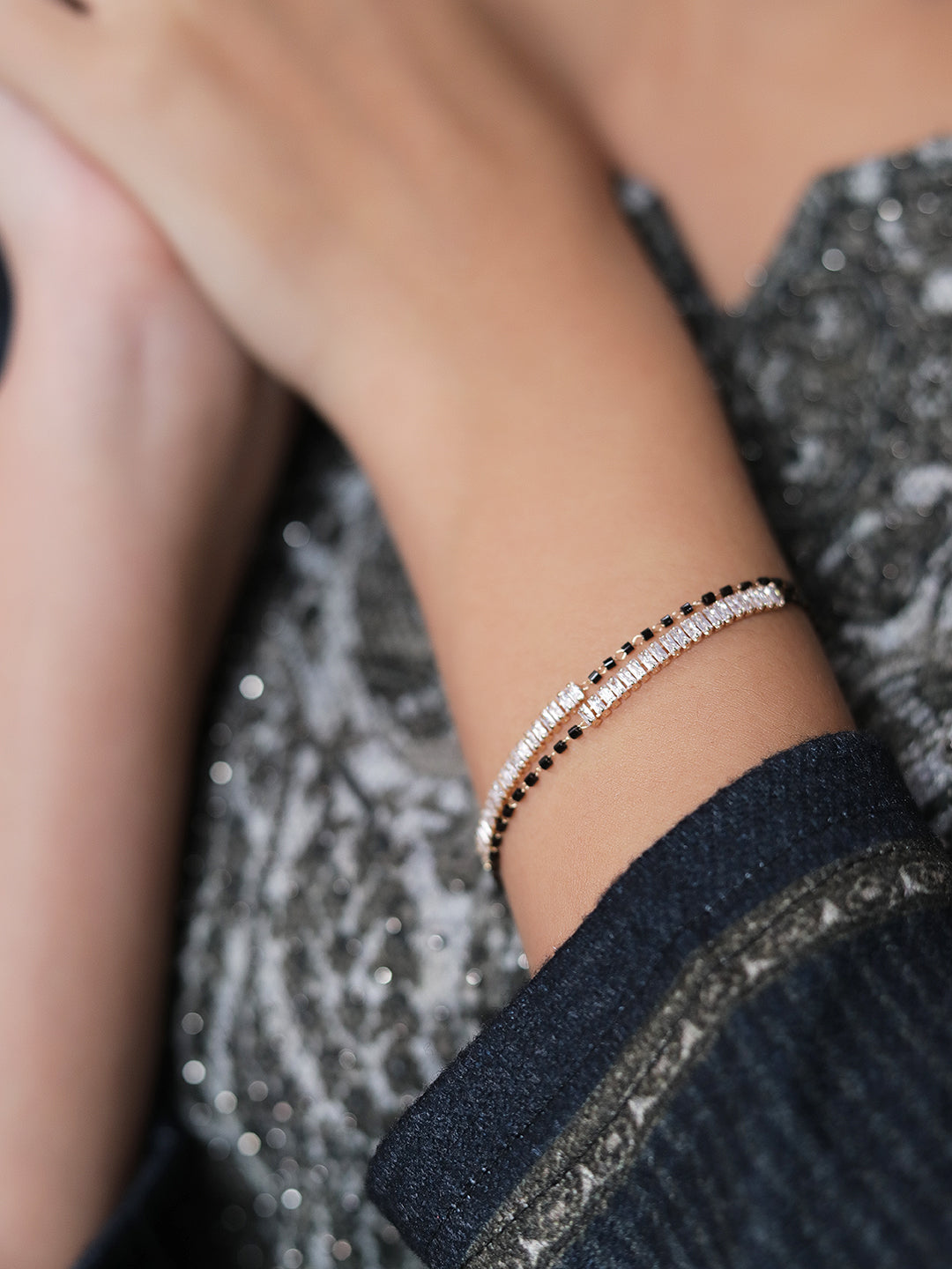 Stylish ladies gold bracelet with delicate black bead detailing