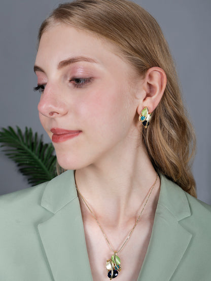 Gold chain with pendant showcasing modern multicolor gemstone design on model