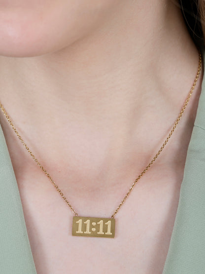 A model wearing a minimalist 11:11 angel number pendant, demonstrating the fit and style of these gold long necklace designs gold.