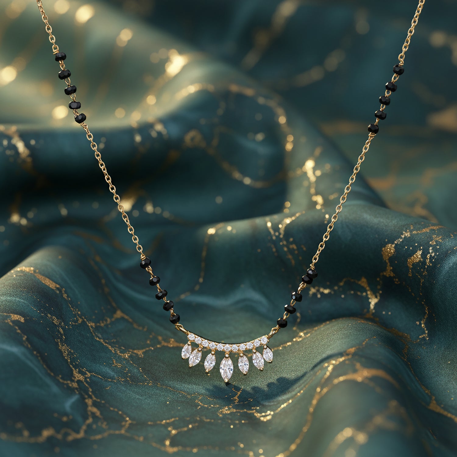 Close-up studio shot of a modern gold mangalsutra featuring a crescent-shaped pendant studded with marquise-cut American diamonds
