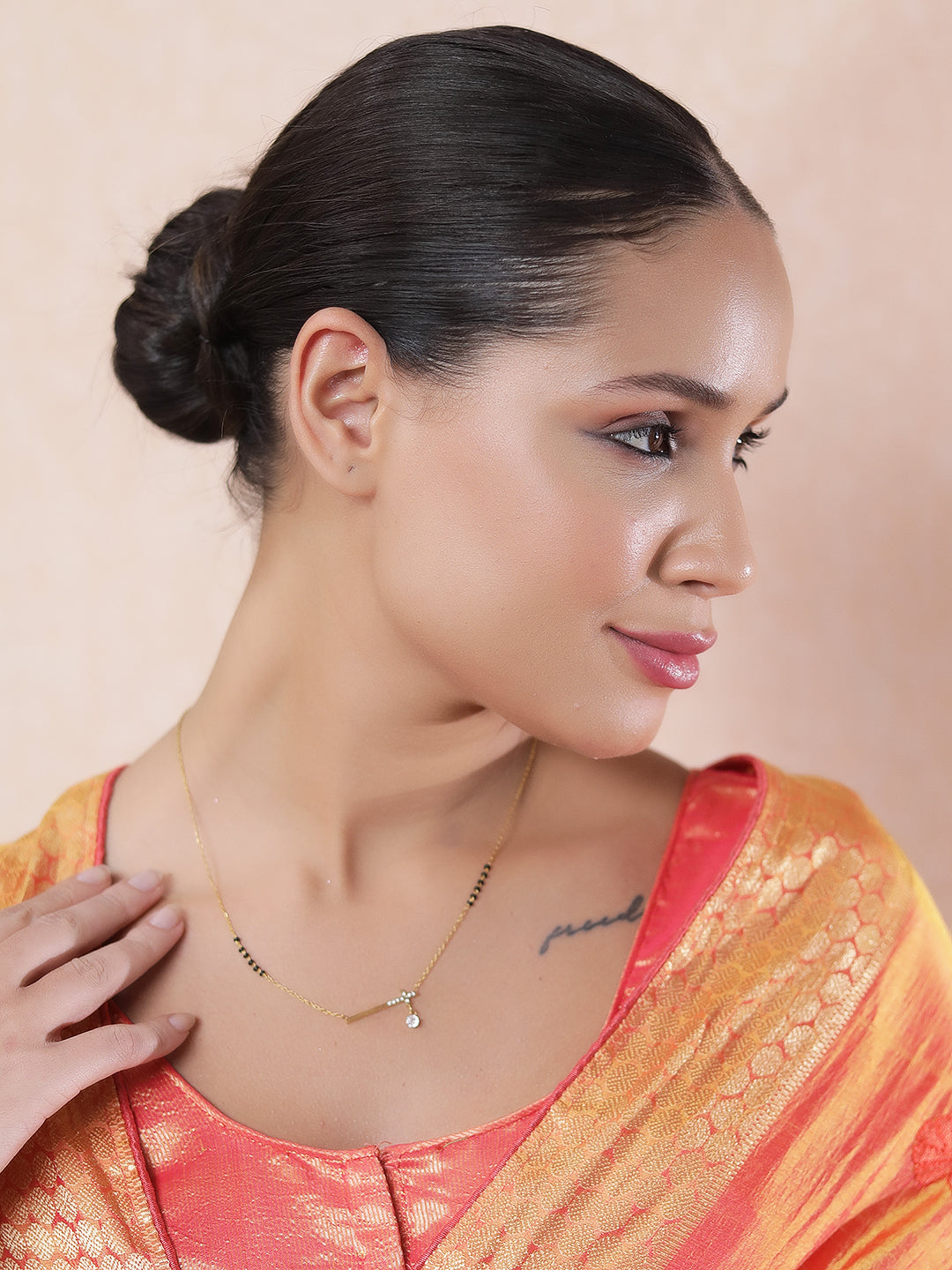 Subtle and simple modern mangalsutra design with a diamond-accented horizontal bar pendant.