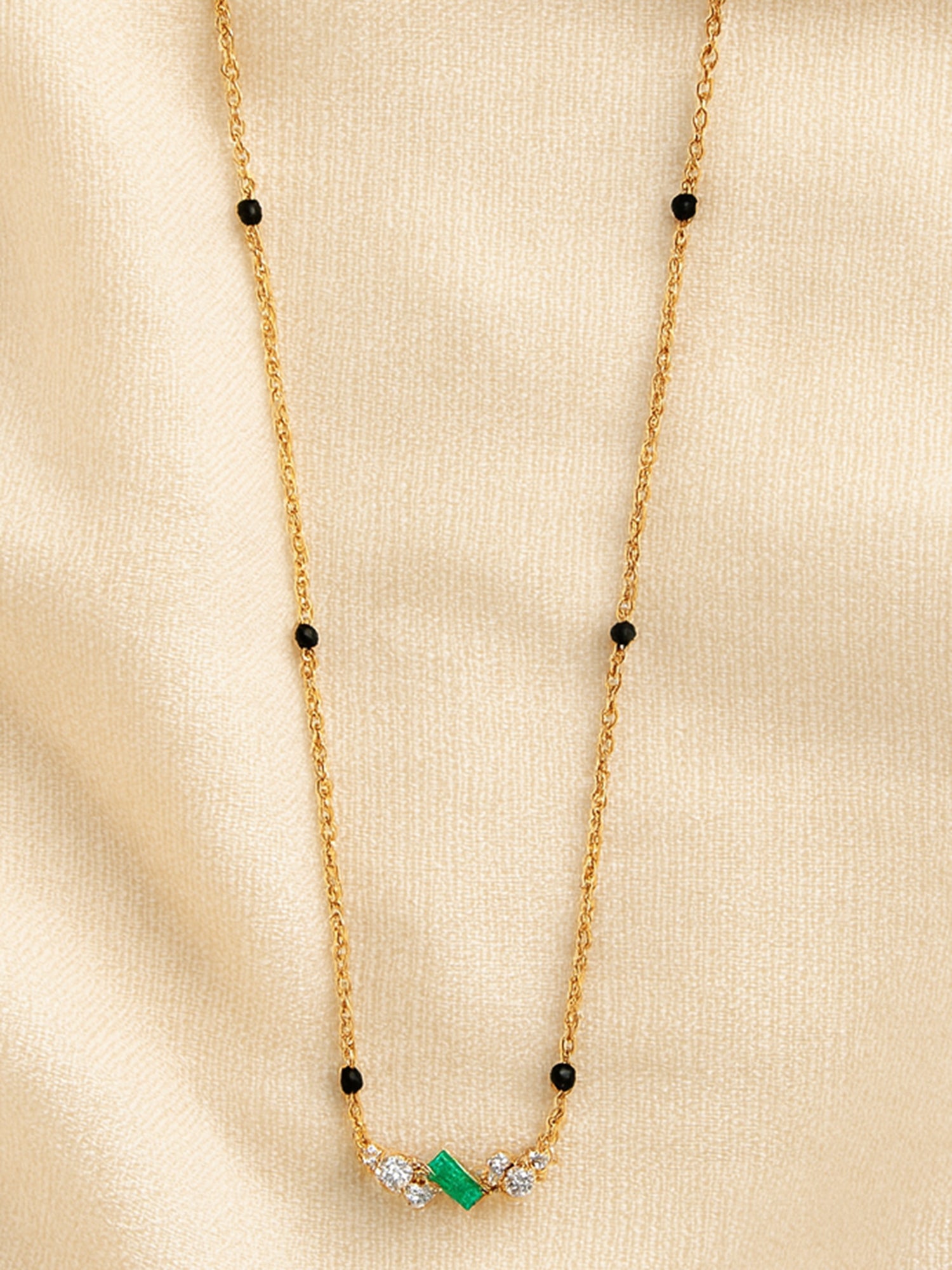 Delicate Gold Mangalsutra with Black Beads and Emerald-cut Green Stone Pendant