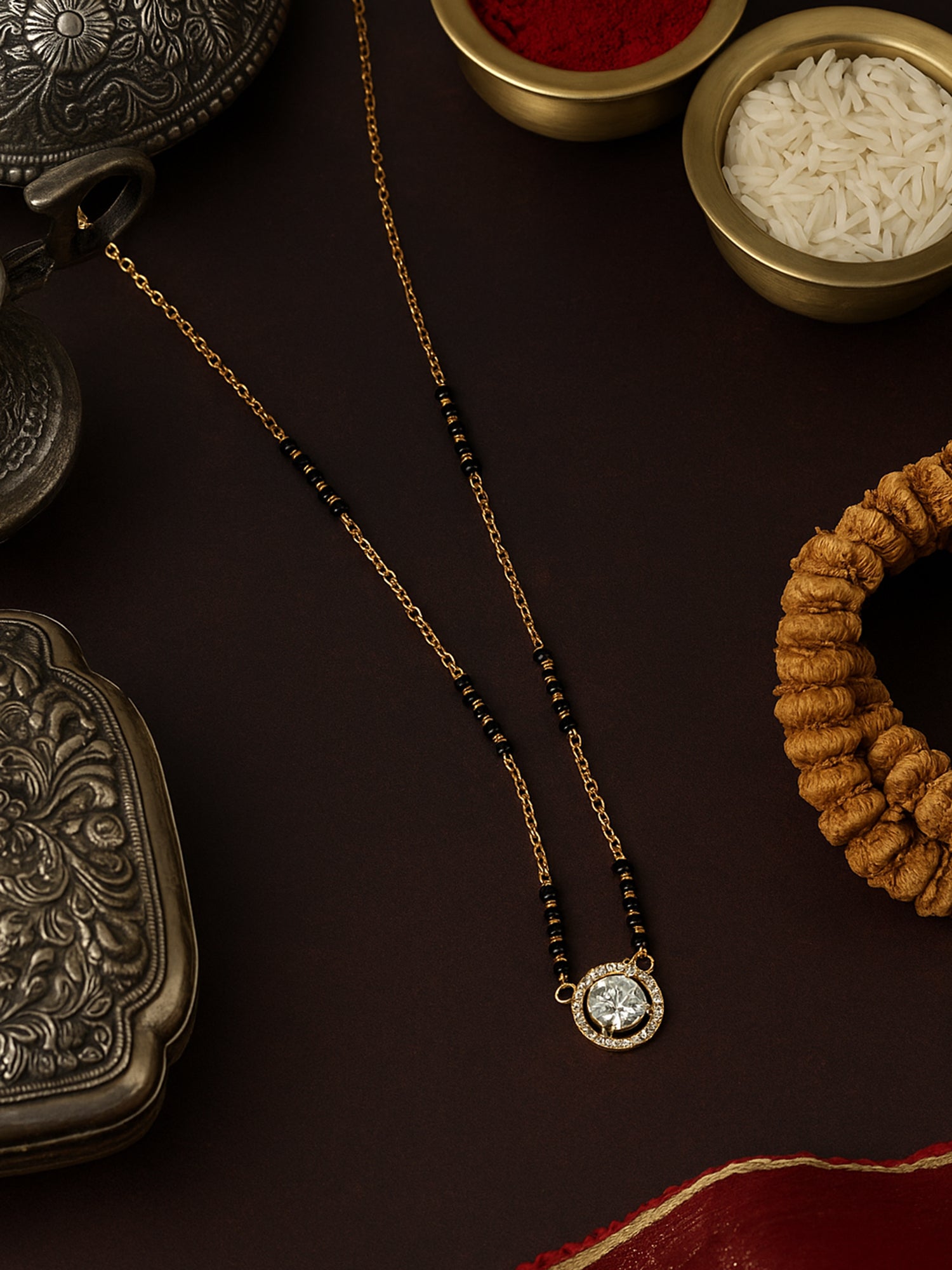 Single-line artificial mangalsutra design featuring a brilliant round Cubic Zirconia solitaire pendant