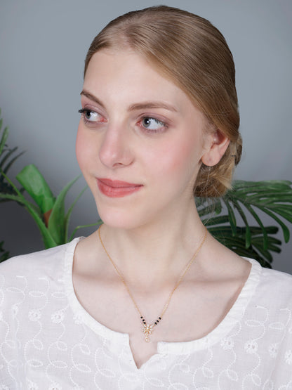 Minimalist simple modern mangalsutra design necklace, perfect for everyday use, with a gold chain and sparkling floral pendant