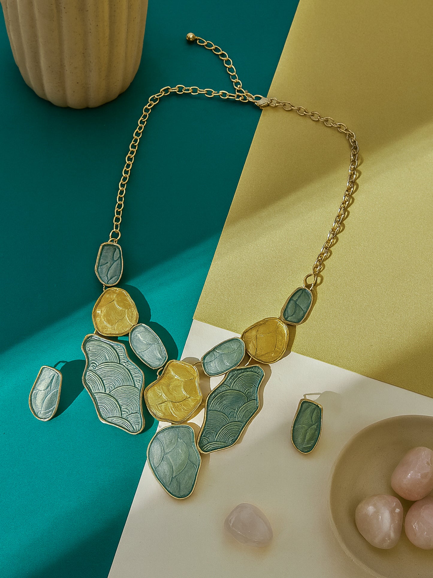 Elegant gold plated silver necklace and earring set paired with pink orchids