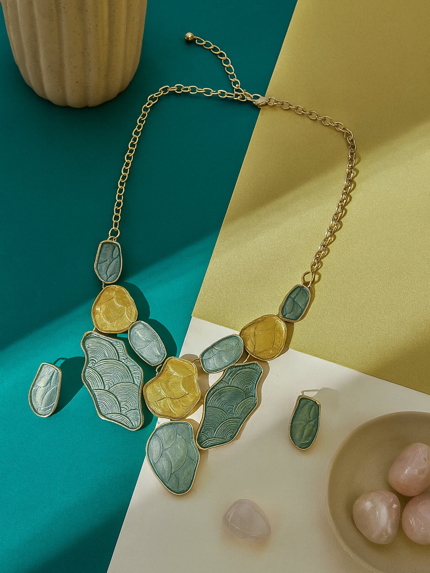 Elegant gold plated silver necklace and earring set paired with pink orchids