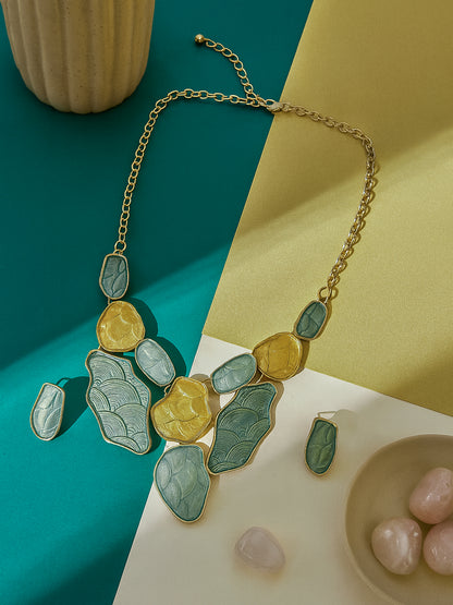 Elegant gold plated silver necklace and earring set paired with pink orchids