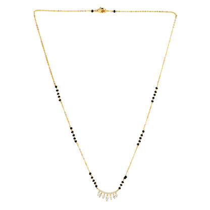 Trending mangalsutra design in gold featuring delicate black beads and a curved CZ leaf pendant, displayed on a plain white background