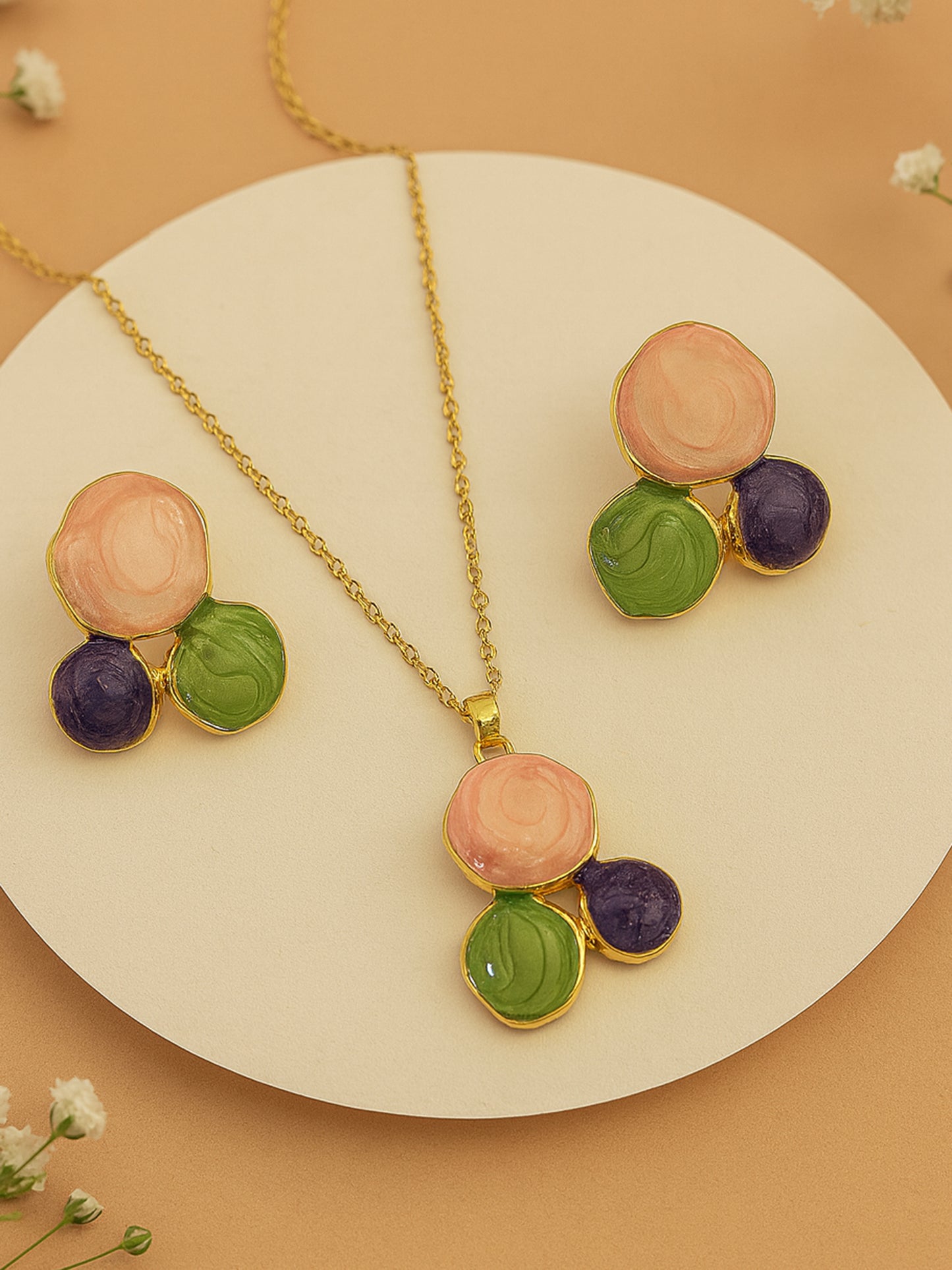Latest gold necklace designs showcasing a modern gold plated necklace and earrings set with a trendy pendant