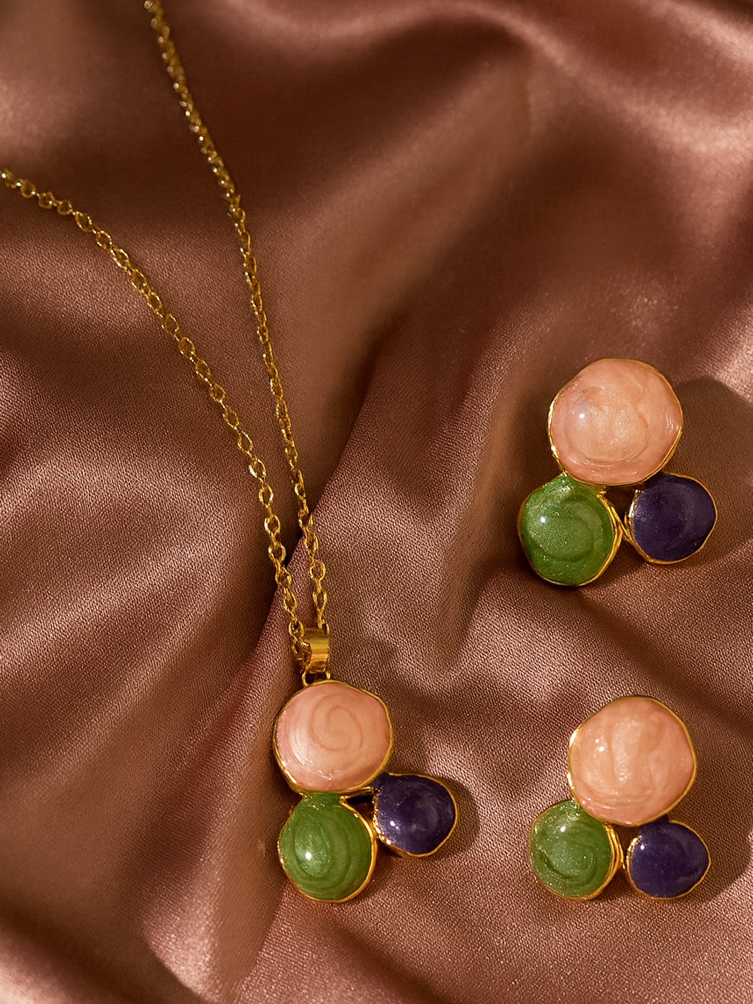 Gold necklace and earring set featuring a stylish pendant and matching earrings in a modern lightweight design for women