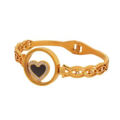 Simple bracelet for women featuring a gold-plated design with a black heart centerpiece and delicate patterned links