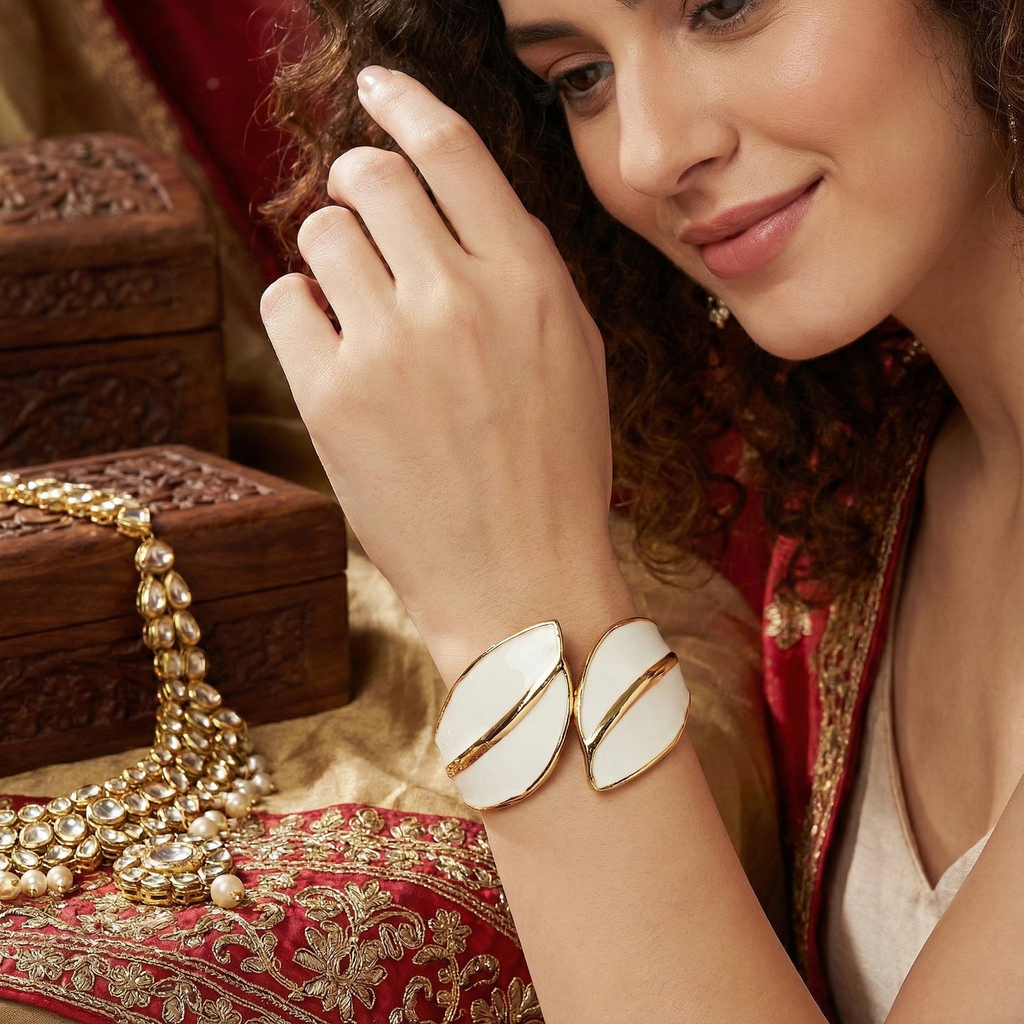 hand bracelet for women styled with traditional ethnic wear and gold jewelry accessories.