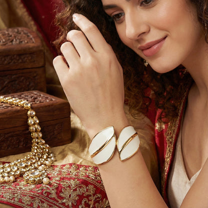 hand bracelet for women styled with traditional ethnic wear and gold jewelry accessories.