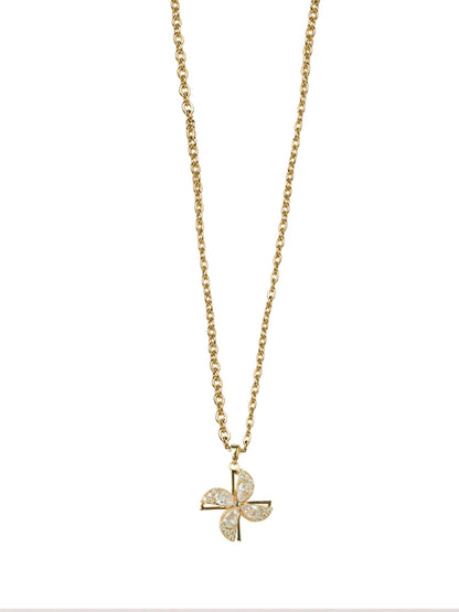 Close-up of a shimmering gold chain with pendant showcasing a kinetic spinning flower charm with marquise-cut crystals on a delicate link chain.