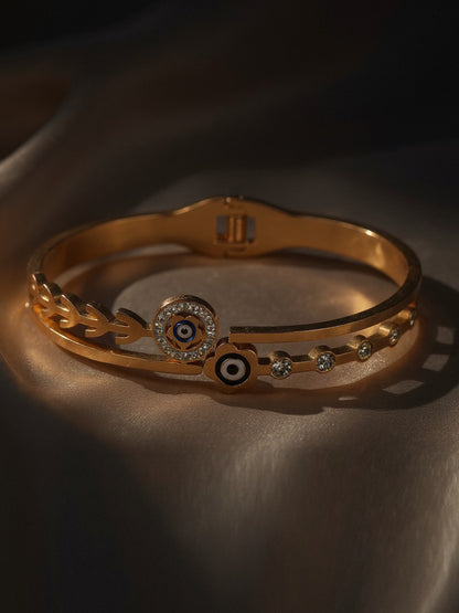 The latest bracelet design in a rose-gold tone, highlighting unique eye motifs and delicate crystal studs.