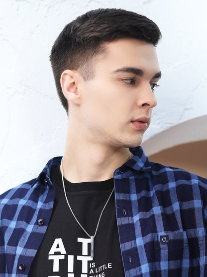 Minimalist long silver necklace displayed in a lifestyle shot.