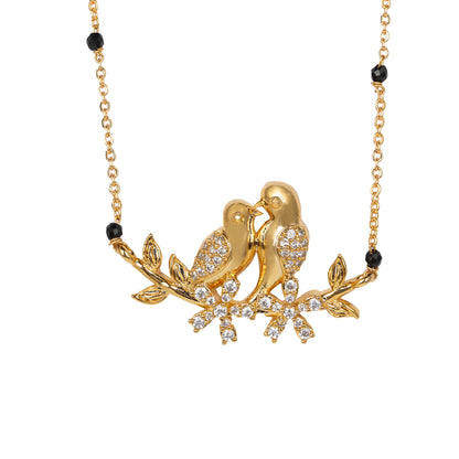 Close-up of a sophisticated modern mangalsutra design showcasing a minimalist gold love birds charm and sparkling floral accents