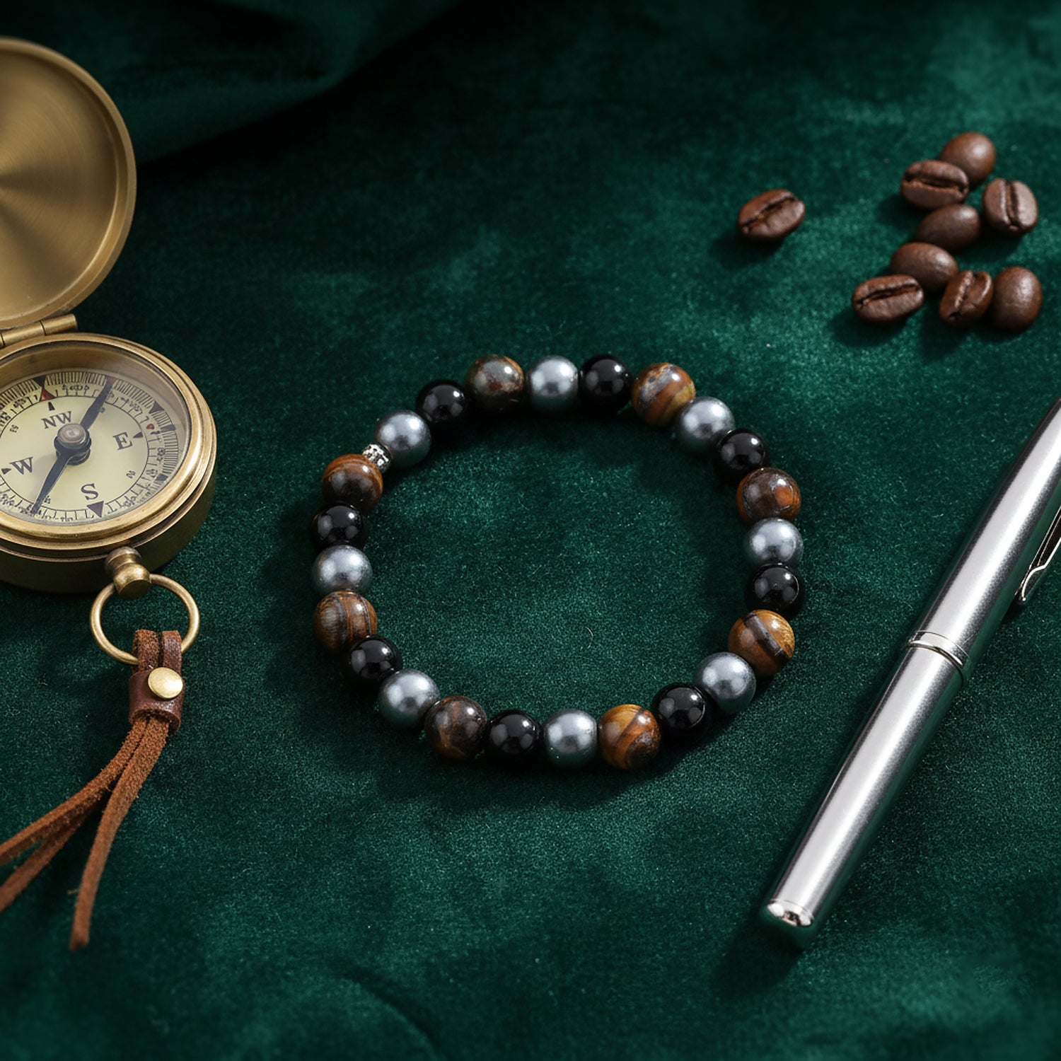 Men’s beaded bracelet with compass, pen, and coffee beans
