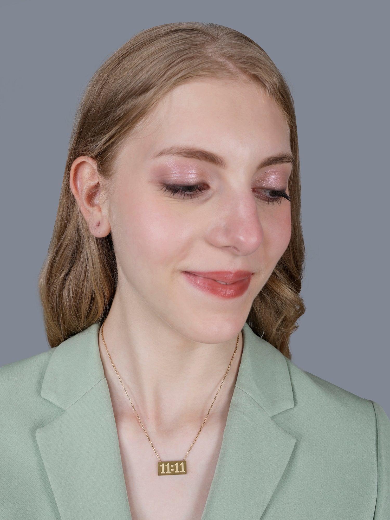 A rectangular 11:11 manifestation bar pendant showcasing one of the latest gold necklace design