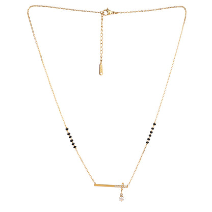 Model wearing one of the trending small mangalsutra designs in gold