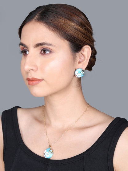 Modern gold necklace design featuring a round turquoise and white enamel floral pendant and stud earrings