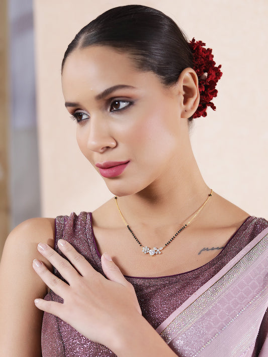 Elegant woman wearing heart floral gold mangalsutra design