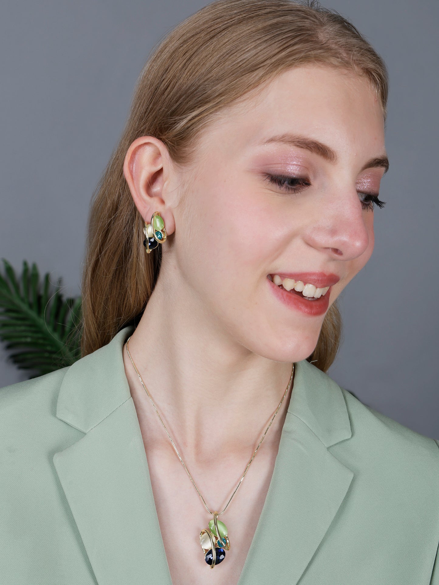 Light weight gold necklace gold with multicolor gemstone pendant worn by model