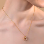 Gold-Tone Circular Charm Necklace with Pave Stones