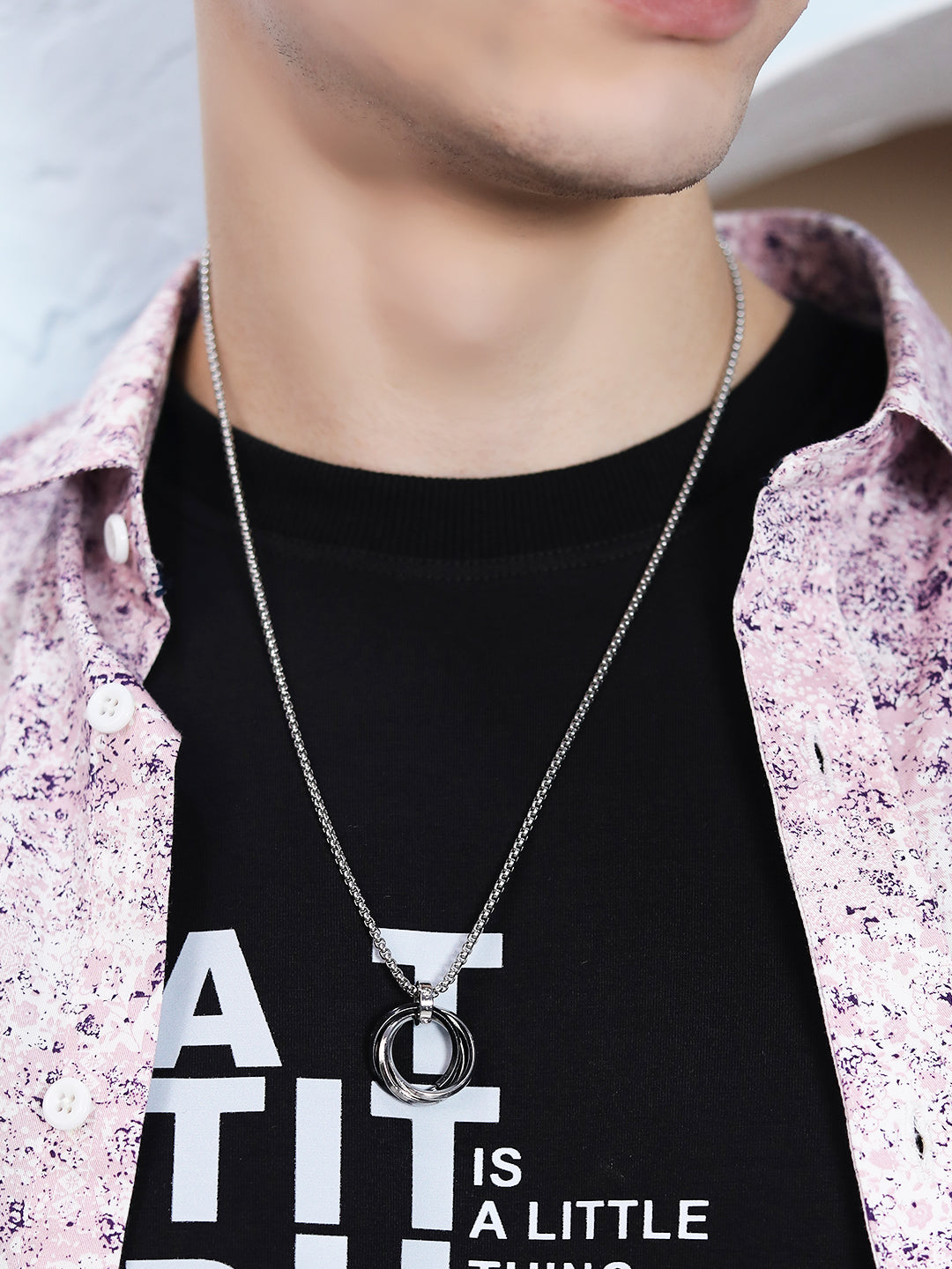 Men’s silver chain featuring modern interlocking ring pendant