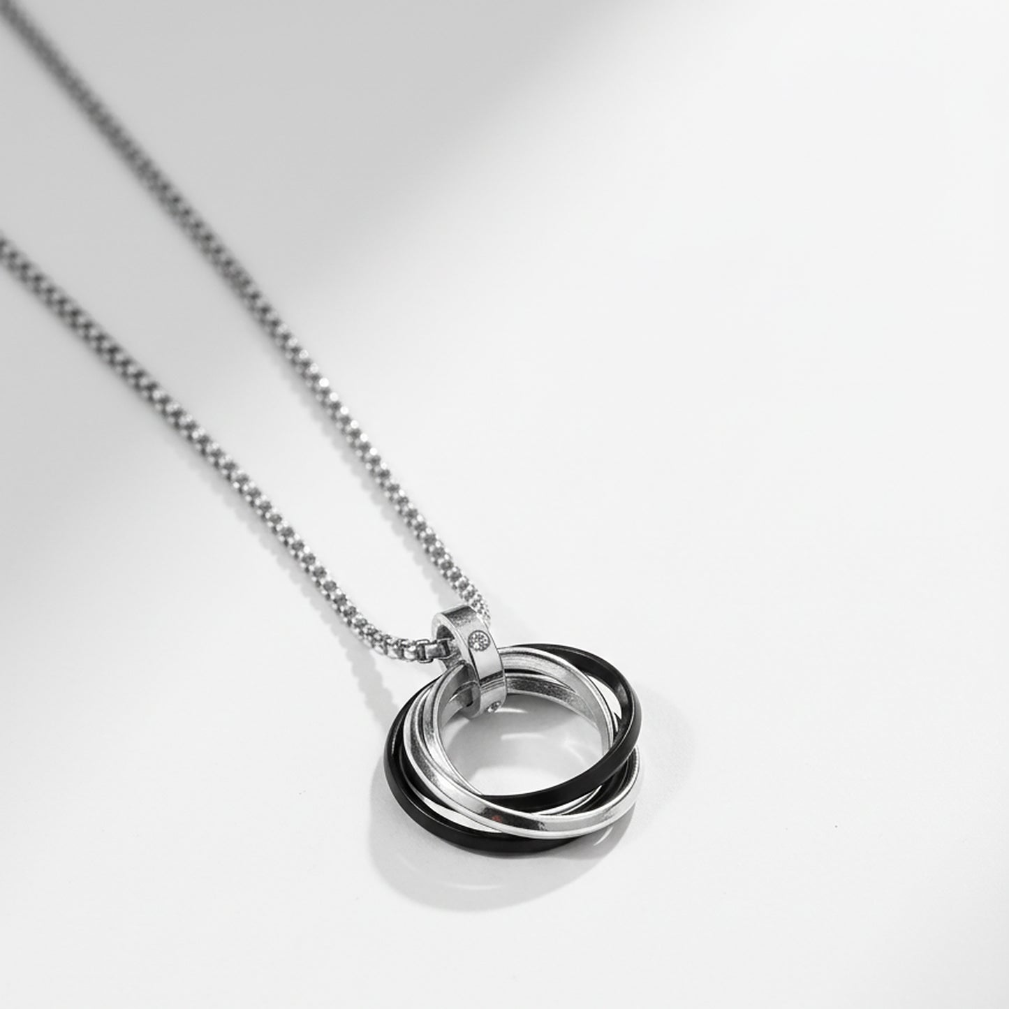 Sterling silver necklace with interlocking ring pendant
