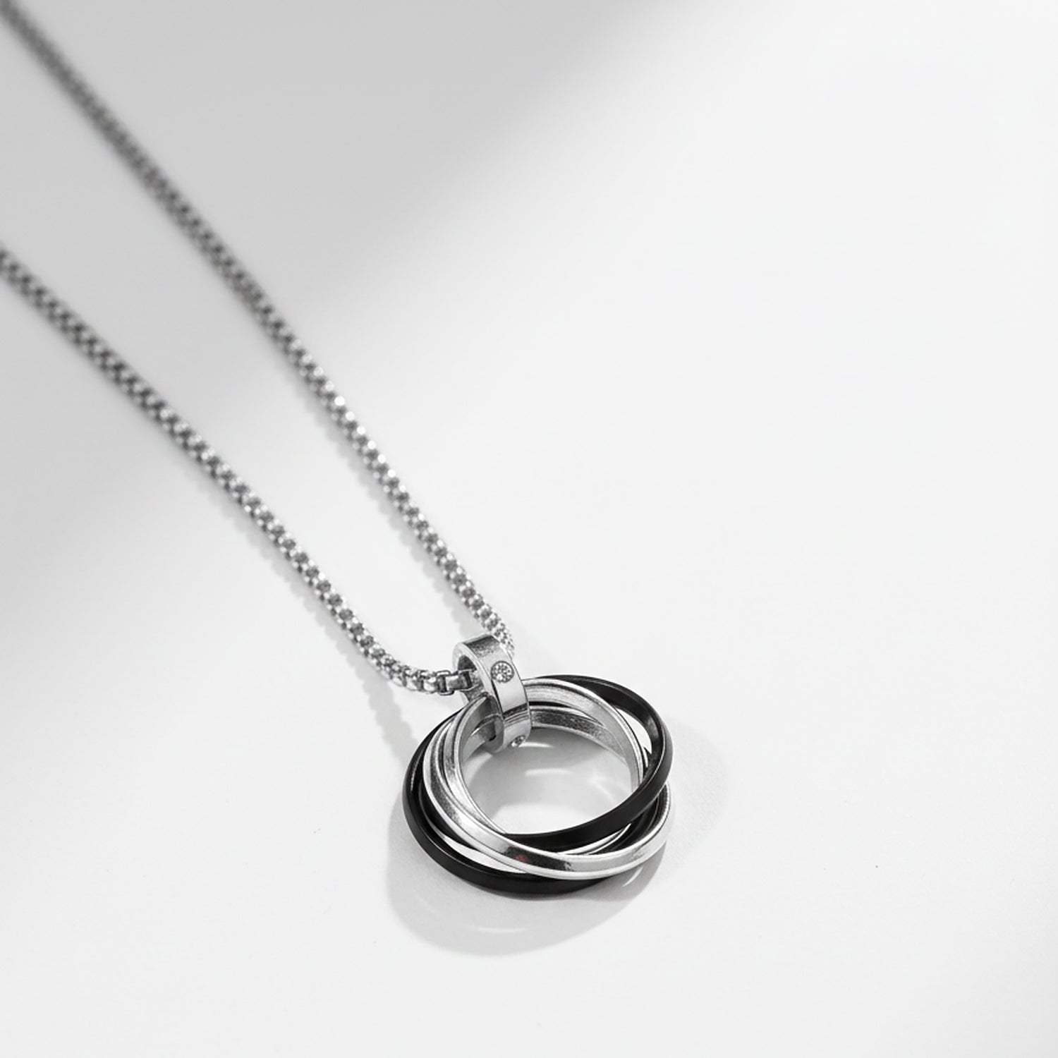 Sterling silver necklace with interlocking ring pendant