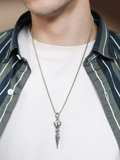 Sterling silver necklace with detailed pendant on white T-shirt