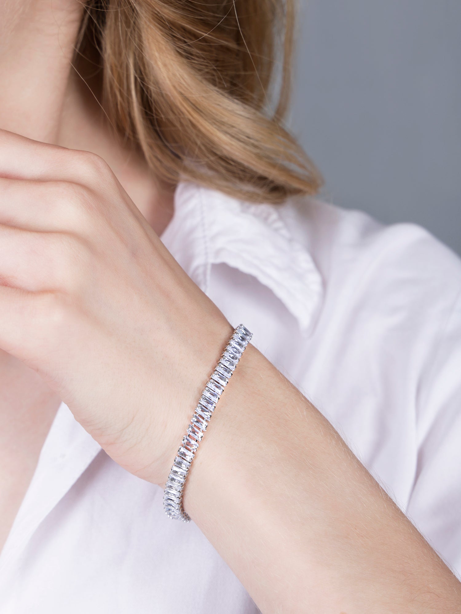 Detailed close-up of a hand bracelet for women showing the brilliant sparkle of the silver-set crystals.