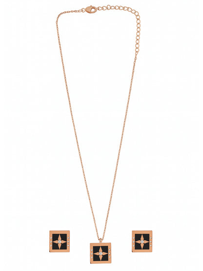 Rose gold chain with pendant featuring a square black enamel and crystal compass-star design, and matching stud earrings