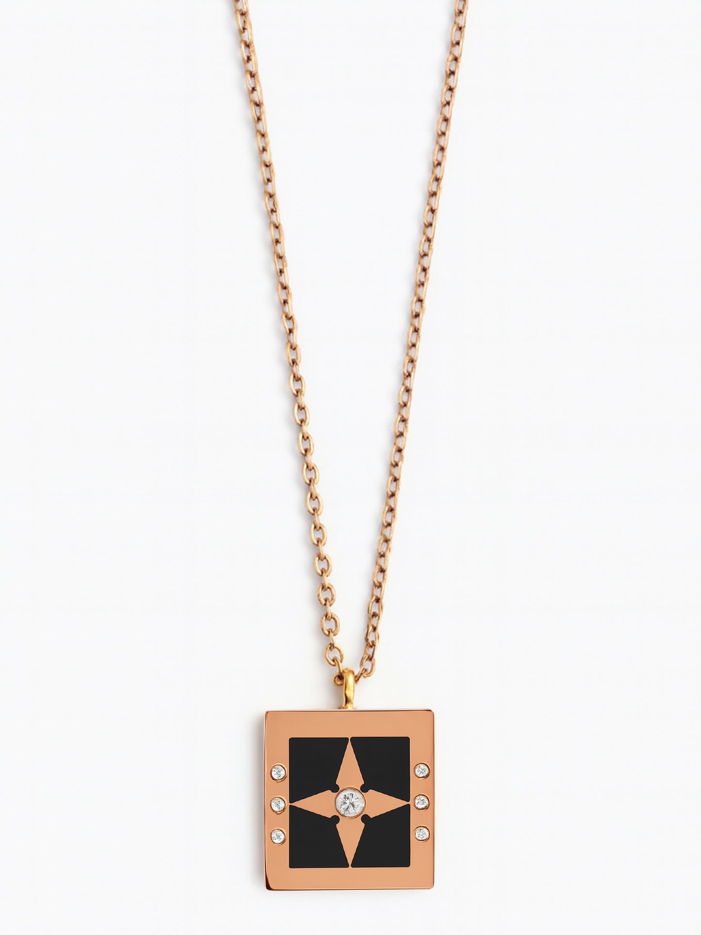 Modern rose gold-tone necklace for women featuring a black enamel square pendant with a central star
