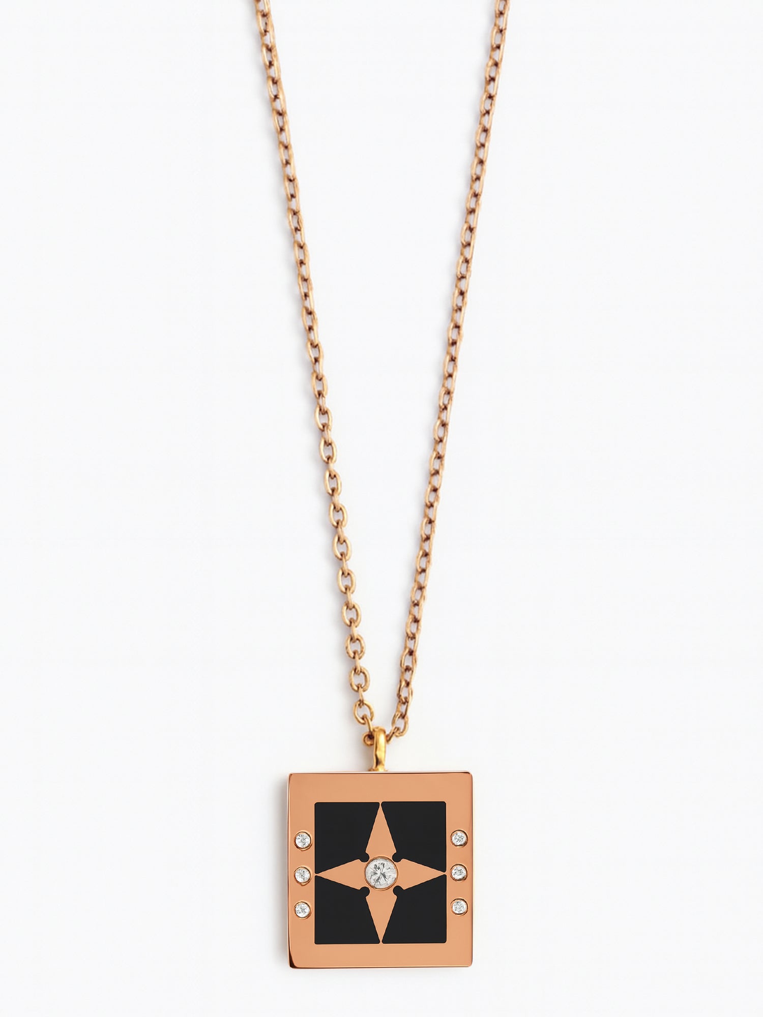 Modern rose gold-tone necklace for women featuring a black enamel square pendant with a central star
