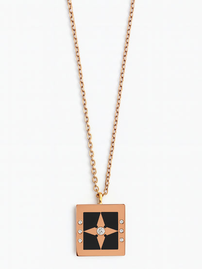 Modern rose gold-tone necklace for women featuring a black enamel square pendant with a central star

