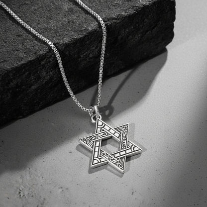 Silver pendant necklace with engraved star-shaped charm