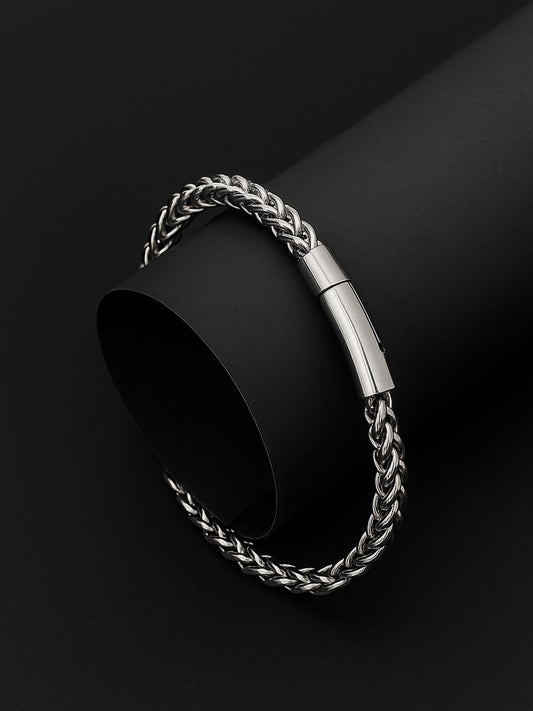 Sterling silver bracelet for men with a sleek braided chain and magnetic clasp on a black background.