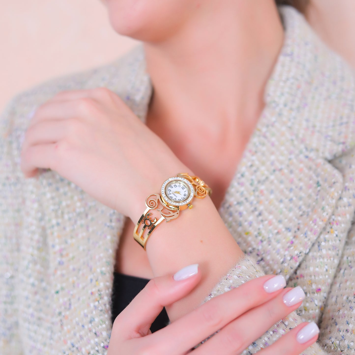 Fashionable and stylish bracelet for women worn on the wrist, showcasing the ornate floral and swirl patterns.