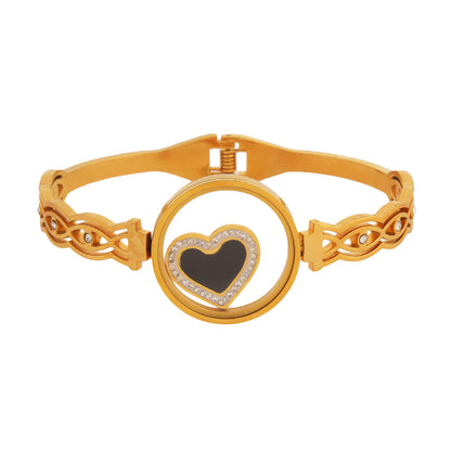 Gold plated bracelet for ladies with a heart-shaped center design on a white background.